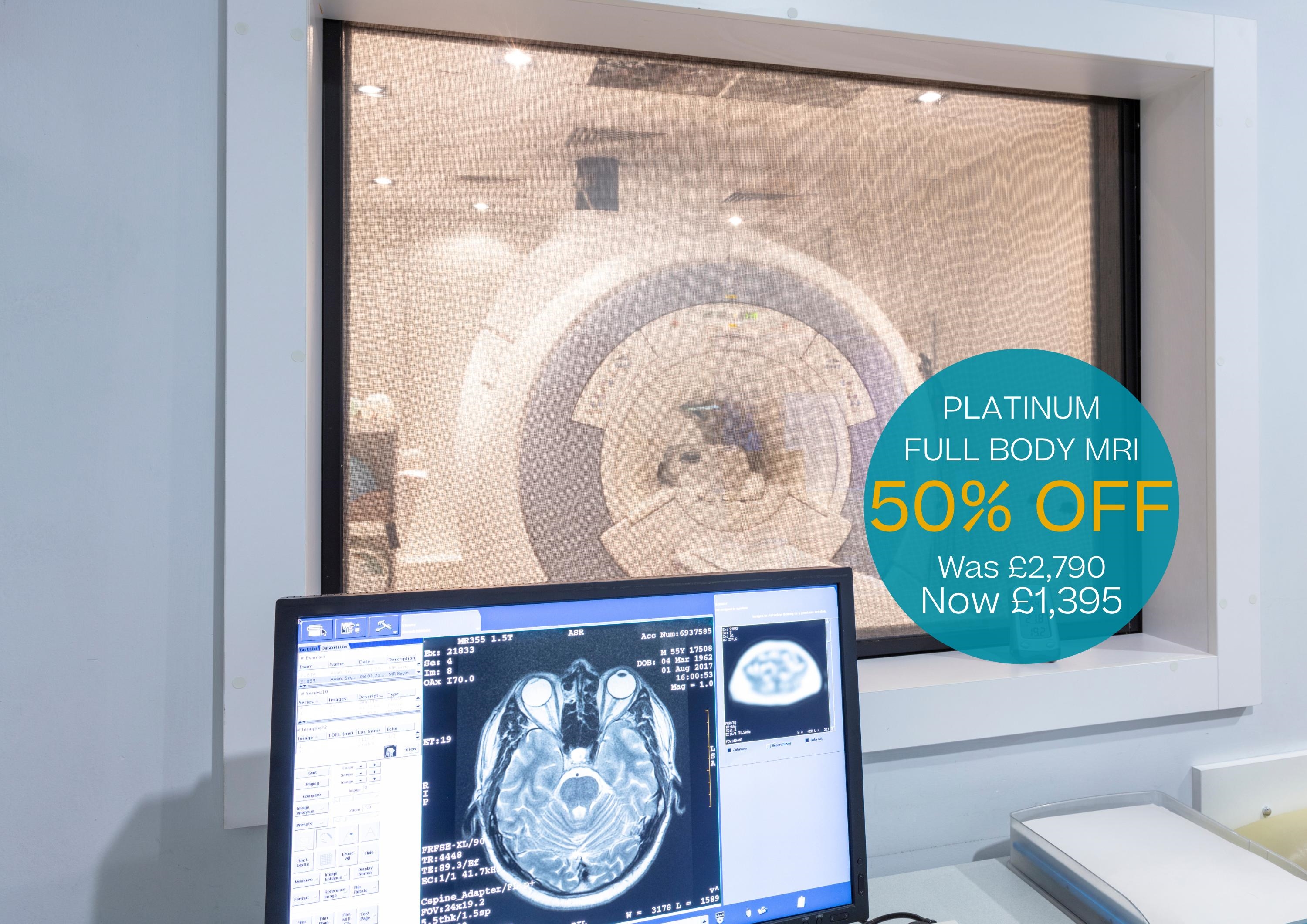 MRI machine and computer screen of a brain scan MRI machine and computer screen of a brain scan